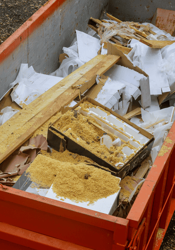 Metal container full of residential debris