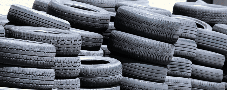 Tires stacked in a pile at tire recycling center